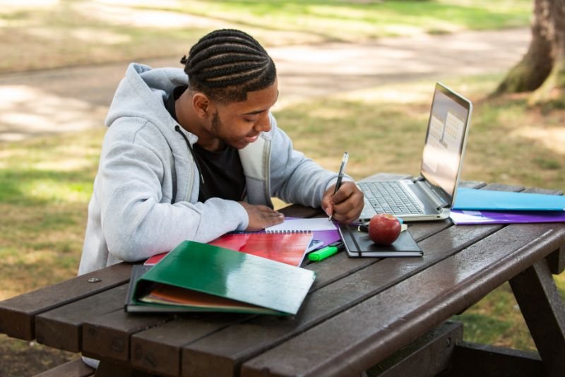 College student mastering the art of balancing studies and entrepreneurship, a true multitasking wizard.