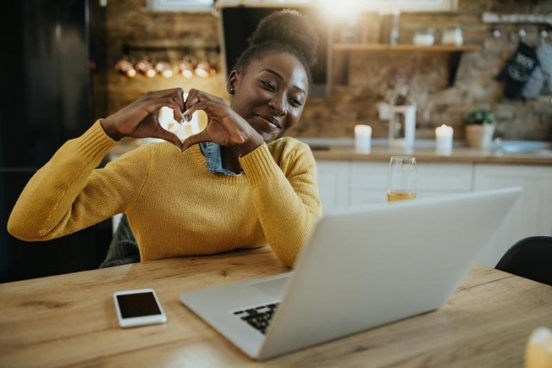 A student maintaining a long-distance relationship through video chat.