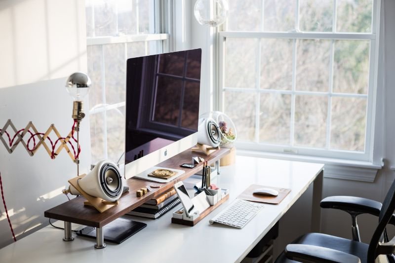 Organized digital workspace with laptop, notebooks, and study essentials.